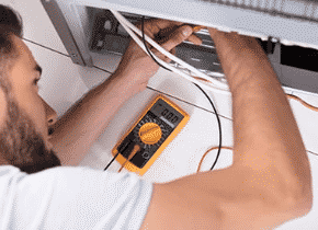 electrician fixing air conditioner